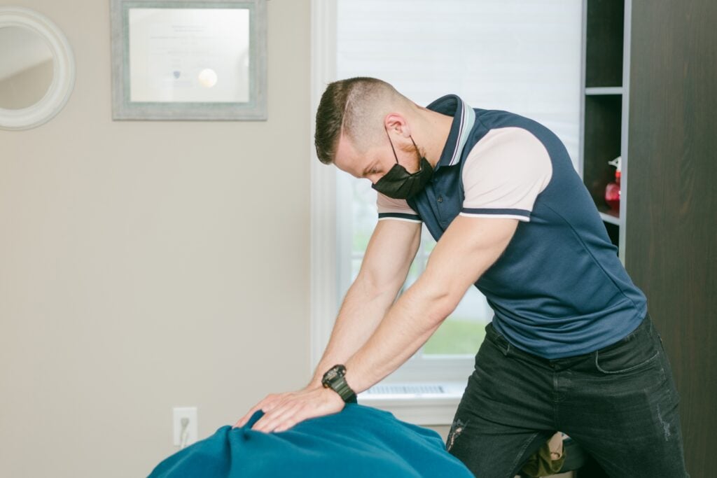 Registered massage therapist providing massage therapy treatment at our Newmarket clinic