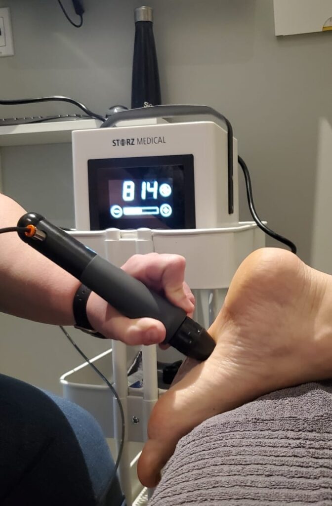 patient receiving shockwave therapy at newmarket clinic